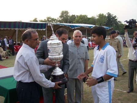 CCH captain receiving the hockey trophy